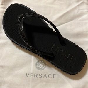 Gorgeous Embossed Versace’s Medusa icon and signature Greek key detailing.